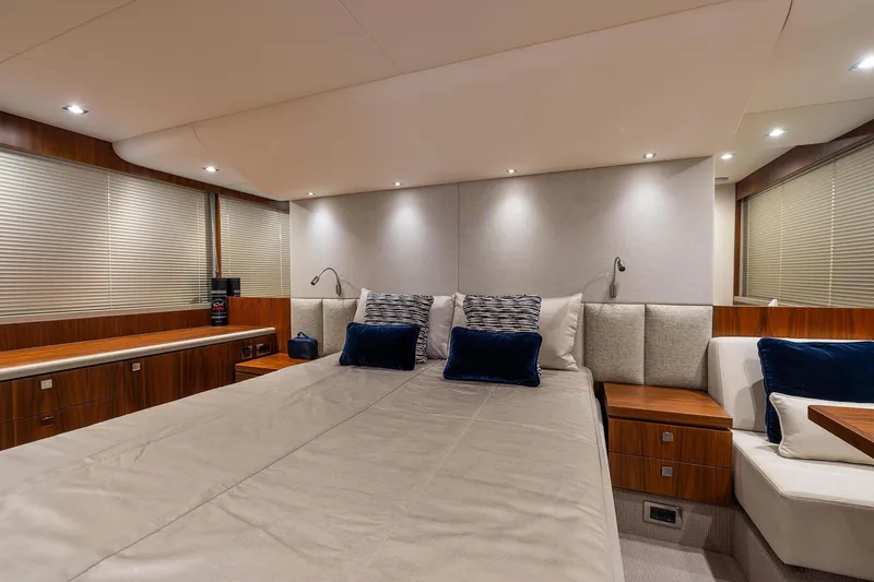  Yacht Photos Pics Luxurious bedroom interior of 2020 Sunseeker Manhattan 52 yacht with elegant decor.