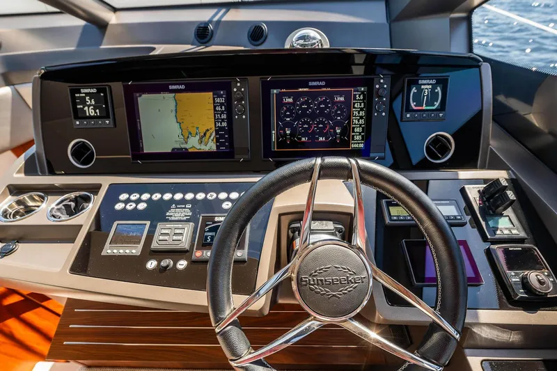  Yacht Photos Pics Cockpit of 2020 Sunseeker Manhattan 52 yacht with advanced navigation displays.
