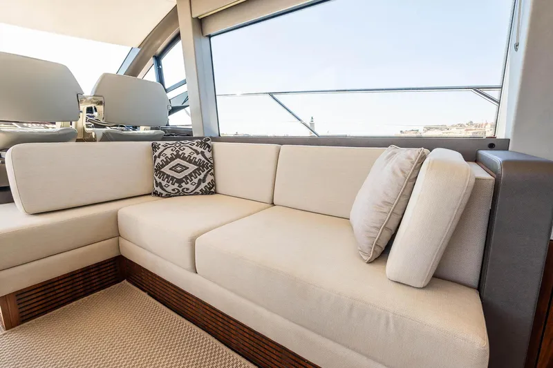  Yacht Photos Pics Luxurious interior of 2020 Sunseeker Manhattan 52 yacht with elegant beige seating.