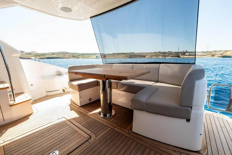  Yacht Photos Pics Luxurious Sunseeker Manhattan 52 yacht deck with seating and table, 2020 model.