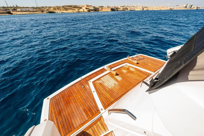  Yacht Photos Pics Sunseeker Manhattan 52 yacht deck overlooking blue ocean and distant coastline, 2020 model.