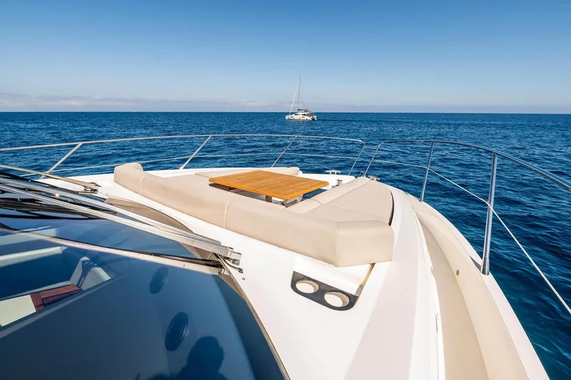  Yacht Photos Pics 2020 Sunseeker Manhattan 52 yacht deck with ocean view and seating area.