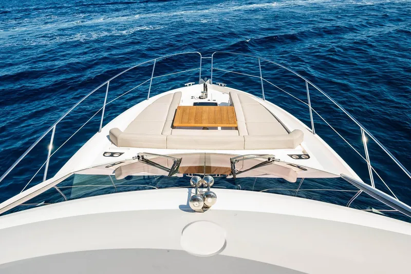  Yacht Photos Pics Sunseeker Manhattan 52 yacht, 2020 model, cruising on open blue sea.