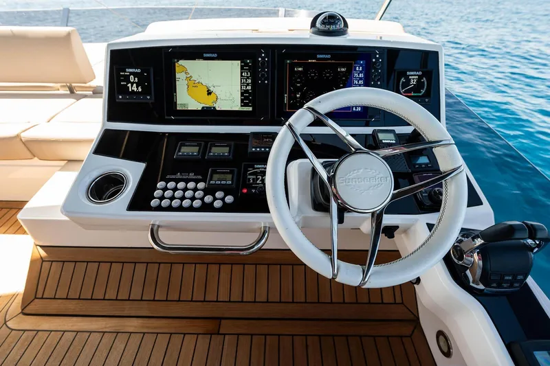  Yacht Photos Pics Sunseeker Manhattan 52 yacht helm with advanced navigation systems, 2020 model.