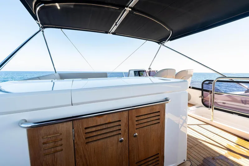  Yacht Photos Pics Flybridge of 2020 Sunseeker Manhattan 52 yacht with ocean view and sleek design.