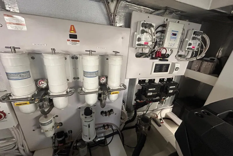  Yacht Photos Pics Engine room of a 2020 Maritimo M64 yacht, featuring filtration and control systems.