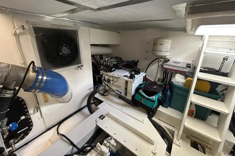  Yacht Photos Pics Engine room of 2020 Maritimo M64 yacht, featuring equipment and storage.