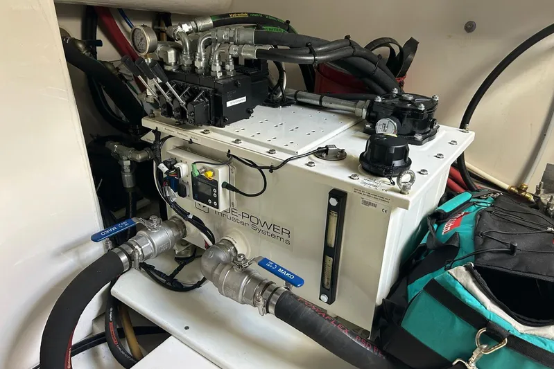  Yacht Photos Pics Engine room of a 2020 Maritimo M64 yacht, featuring mechanical components and wiring.