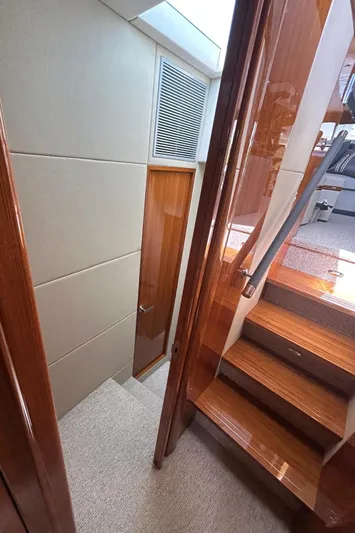  Yacht Photos Pics Interior stairway of 2020 Maritimo M64 yacht with wooden finishes.
