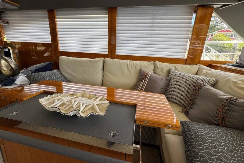  Yacht Photos Pics Luxurious interior of 2020 Maritimo M64 yacht with plush seating and elegant decor.