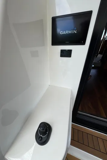  Yacht Photos Pics 2020 Maritimo M64 yacht control panel with Garmin display and joystick.