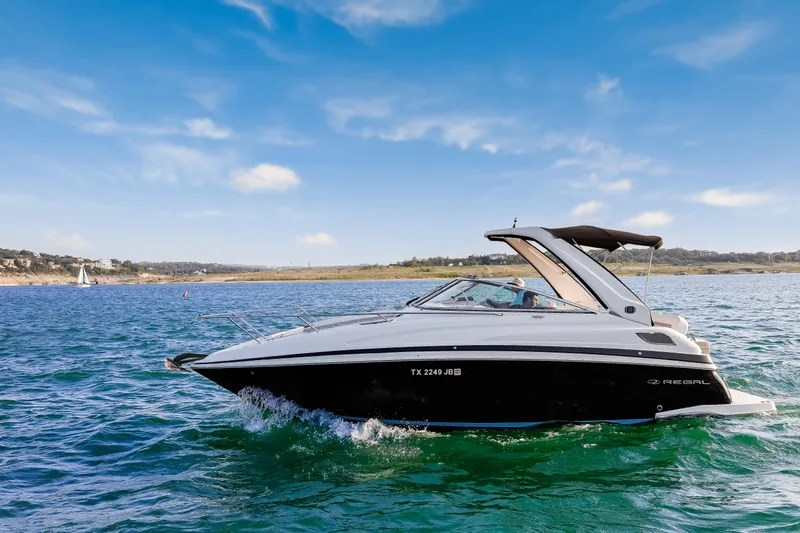 Tarini Yacht Photos Pics 2020 Regal 28 Express boat cruising on a sunny day in open water.