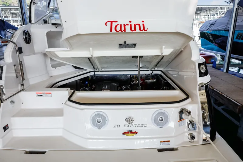 Tarini Yacht Photos Pics 2020 Regal 28 Express boat engine compartment with open hatch, docked in marina.