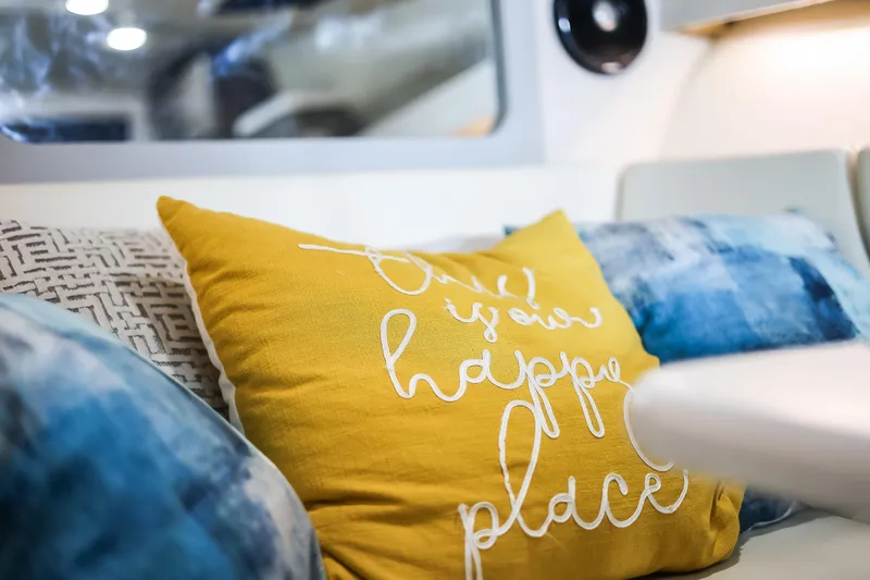 Tarini Yacht Photos Pics Cozy interior of 2020 Regal 28 Express with decorative pillows.