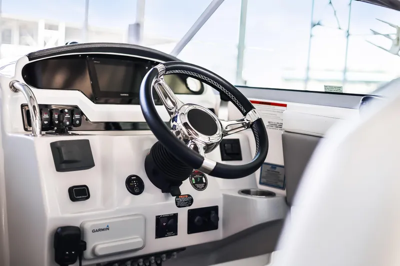 Tarini Yacht Photos Pics Cockpit of 2020 Regal 28 Express boat with steering wheel and controls.