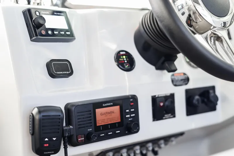 Tarini Yacht Photos Pics Control panel of 2020 Regal 28 Express boat with Garmin and Fusion systems.