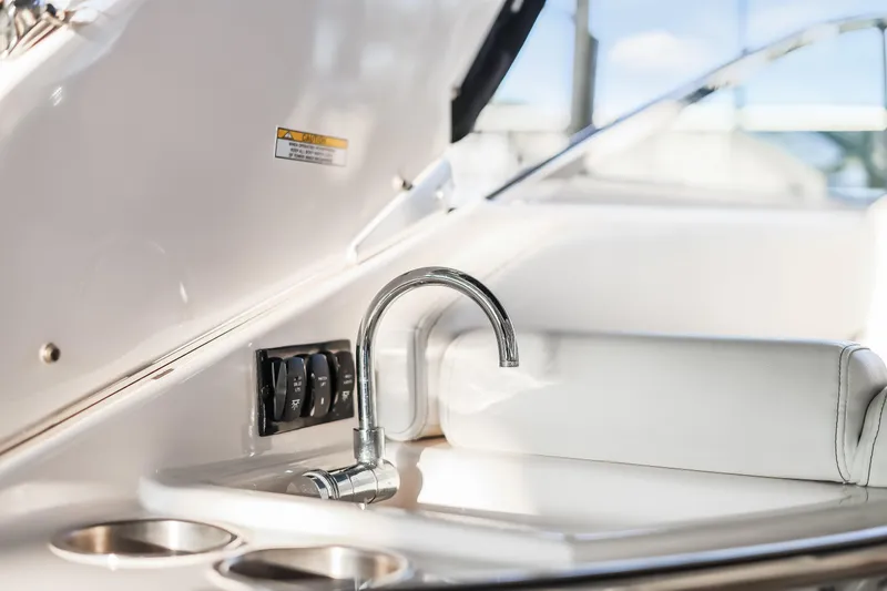 Tarini Yacht Photos Pics 2020 Regal 28 Express boat interior with sink and control panel.