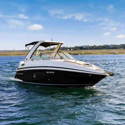 Tarini Yacht Photos Pics 2020 Regal 28 Express boat cruising on a sunny day with scenic shoreline.