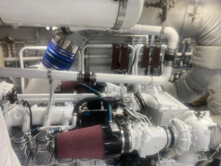 Silver Seas Yacht Photos Pics Engine room of a 1998 Burger Raised Pilothouse yacht with visible pipes and filters.