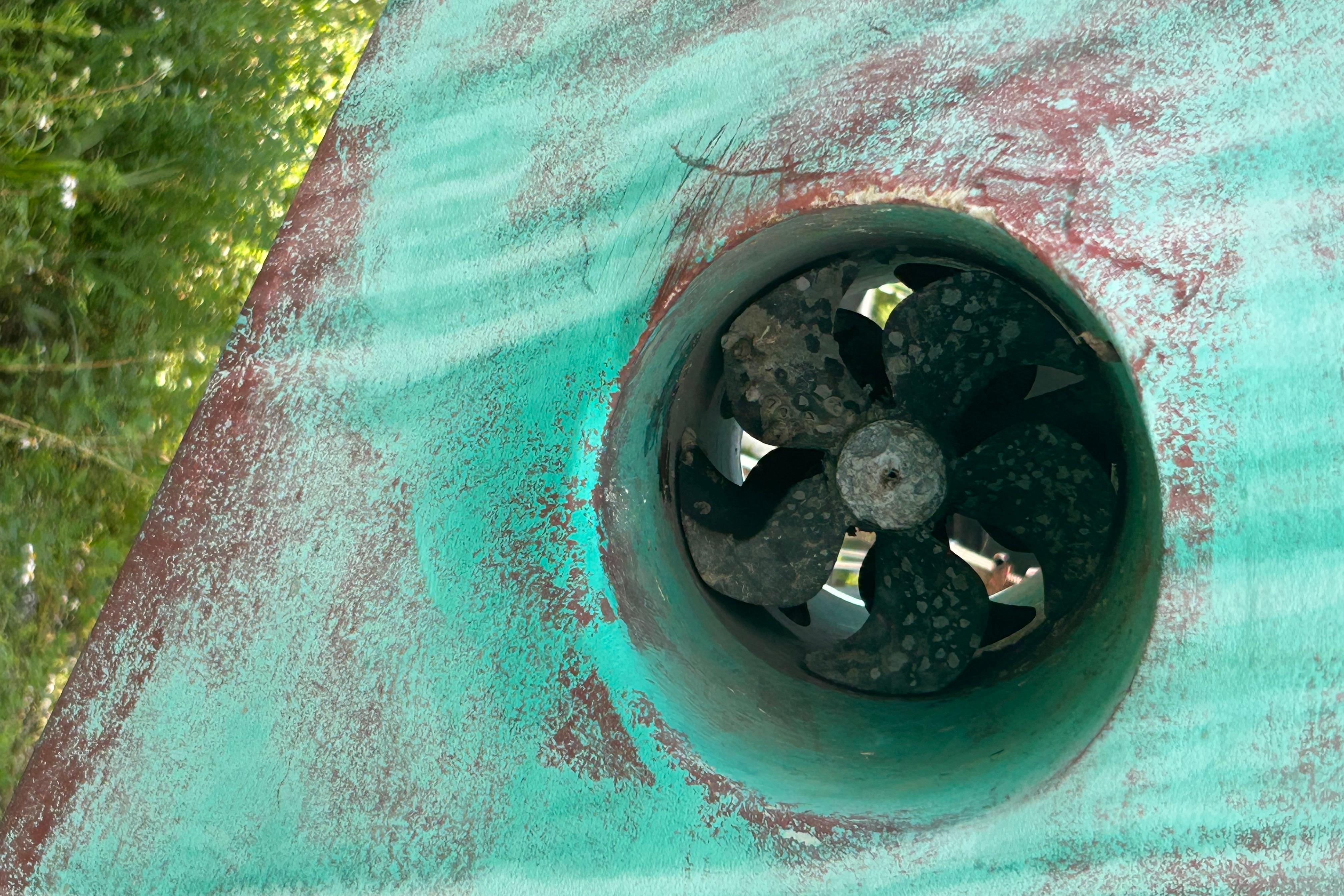 Close-up of a weathered 1981 Hardin 45 Voyager boat propeller.