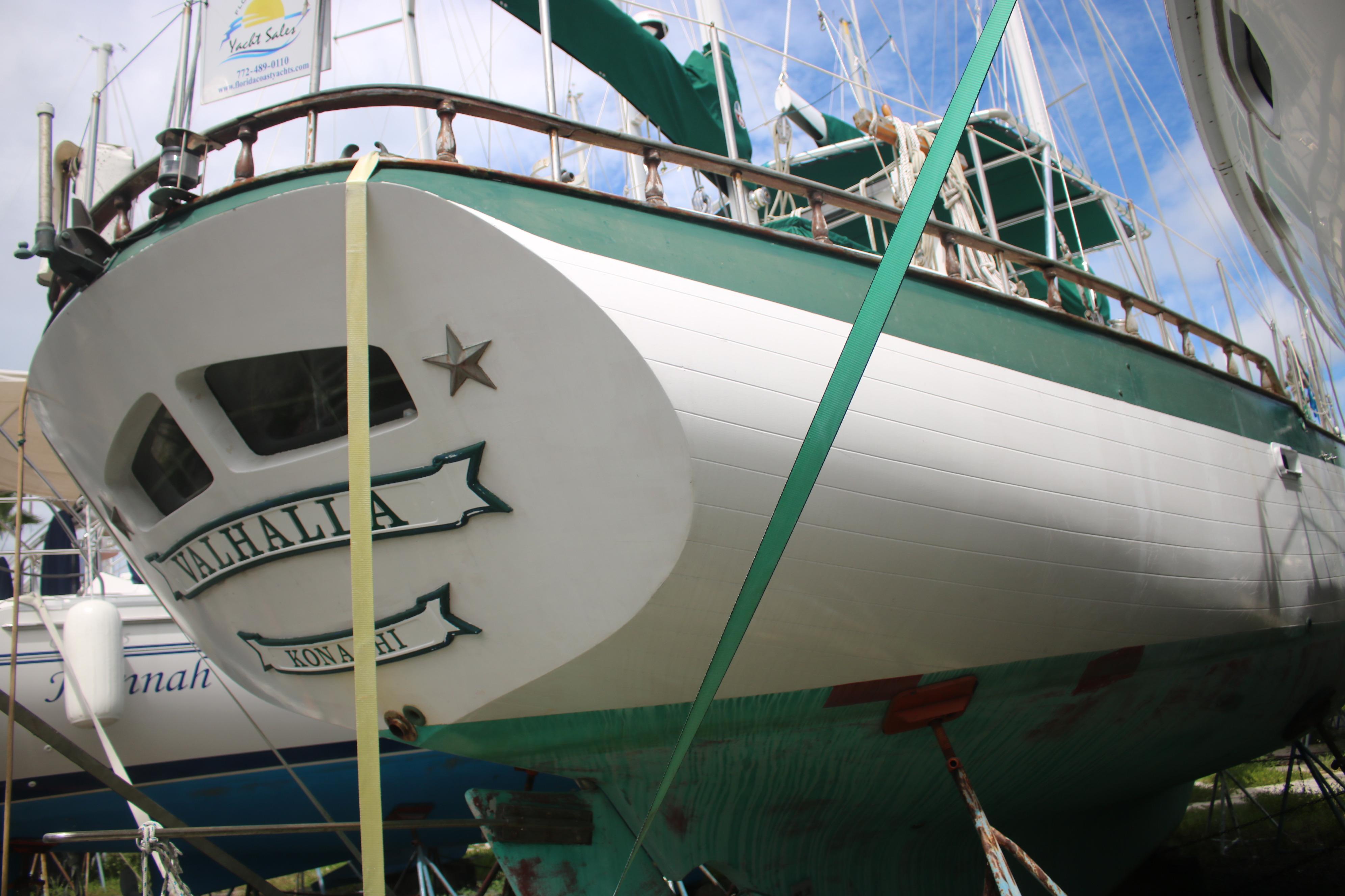 1981 Hardin 45 Voyager sailboat, named Valhalla, docked and secured with straps.