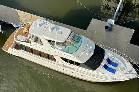 Flying Lady Yacht Photos Pics 2004 Carver 570 Voyager Pilothouse yacht docked at marina, aerial view.