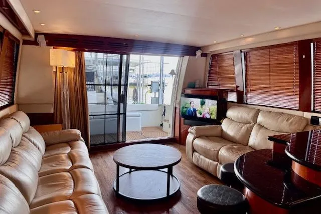 Flying Lady Yacht Photos Pics Luxurious interior of 2004 Carver 570 Voyager Pilothouse with leather seating and modern amenities.