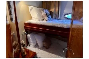 Flying Lady Yacht Photos Pics 2004 Carver 570 Voyager Pilothouse cabin with cozy bunk beds and elegant wood finish.