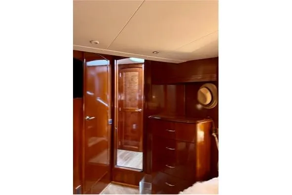 Flying Lady Yacht Photos Pics Luxurious interior of 2004 Carver 570 Voyager Pilothouse with polished wood finish.