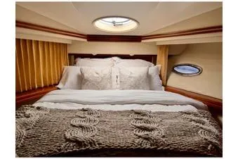 Flying Lady Yacht Photos Pics Luxurious bedroom interior of 2004 Carver 570 Voyager Pilothouse yacht.