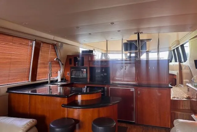 Flying Lady Yacht Photos Pics Luxurious interior of 2004 Carver 570 Voyager Pilothouse yacht with modern kitchen amenities.