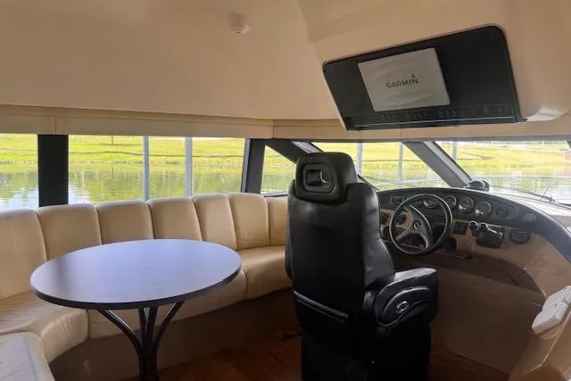 Flying Lady Yacht Photos Pics Interior of 2004 Carver 570 Voyager Pilothouse with leather seating and navigation system.