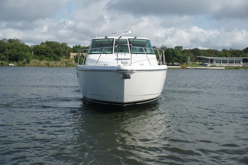 The Pearl Yacht Photos Pics 2007 Tiara Yachts 3900 boat on calm water, front view, under cloudy sky.