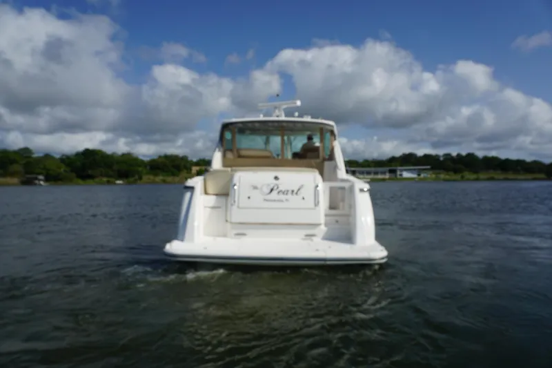 The Pearl Yacht Photos Pics 2007 Tiara Yachts 3900 on water, rear view under cloudy sky.