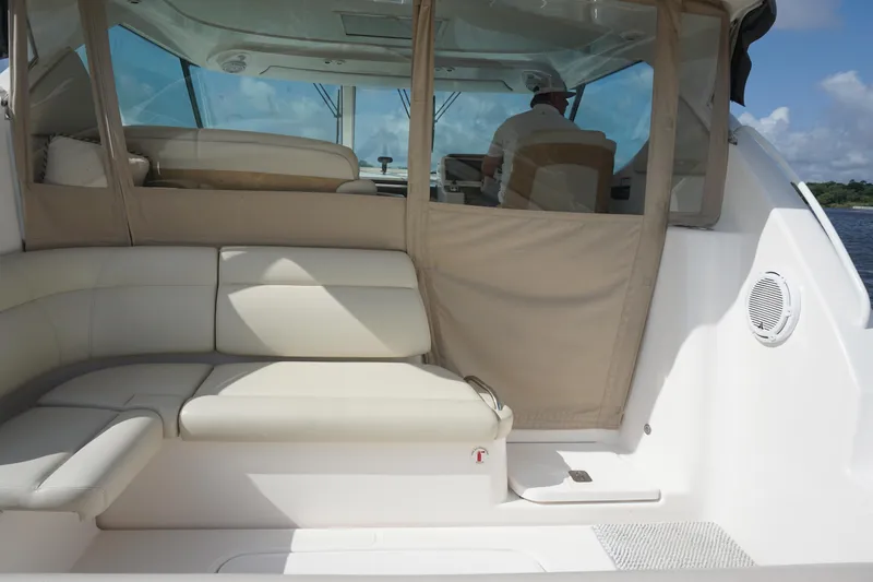 The Pearl Yacht Photos Pics 2007 Tiara Yachts 3900 interior with beige seating and helm station.