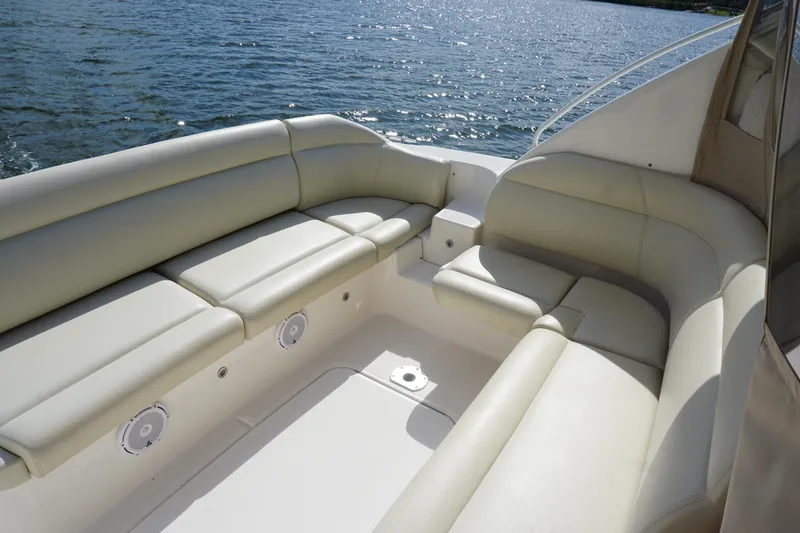The Pearl Yacht Photos Pics 2007 Tiara Yachts 3900 boat interior with cushioned seating by the water.