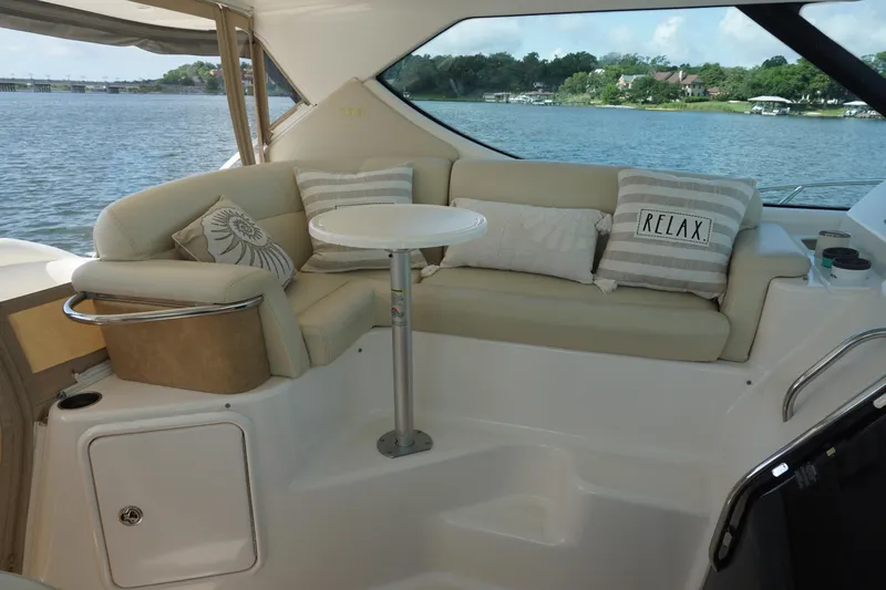 The Pearl Yacht Photos Pics 2007 Tiara Yachts 3900 interior with cozy seating and scenic water view.