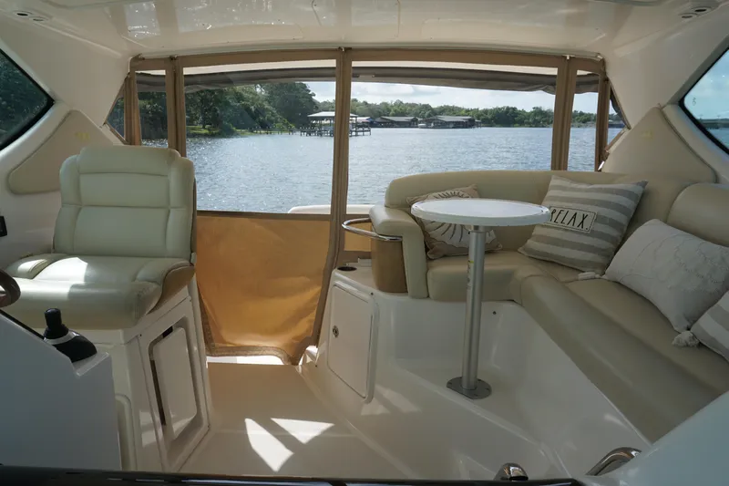 The Pearl Yacht Photos Pics 2007 Tiara Yachts 3900 interior with seating, table, and water view.