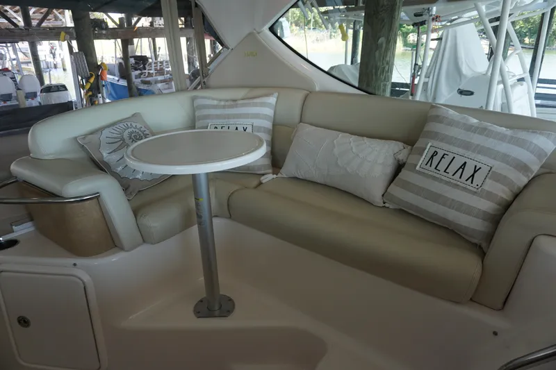 The Pearl Yacht Photos Pics Luxurious seating area on 2007 Tiara Yachts 3900 with "Relax" pillows and table.