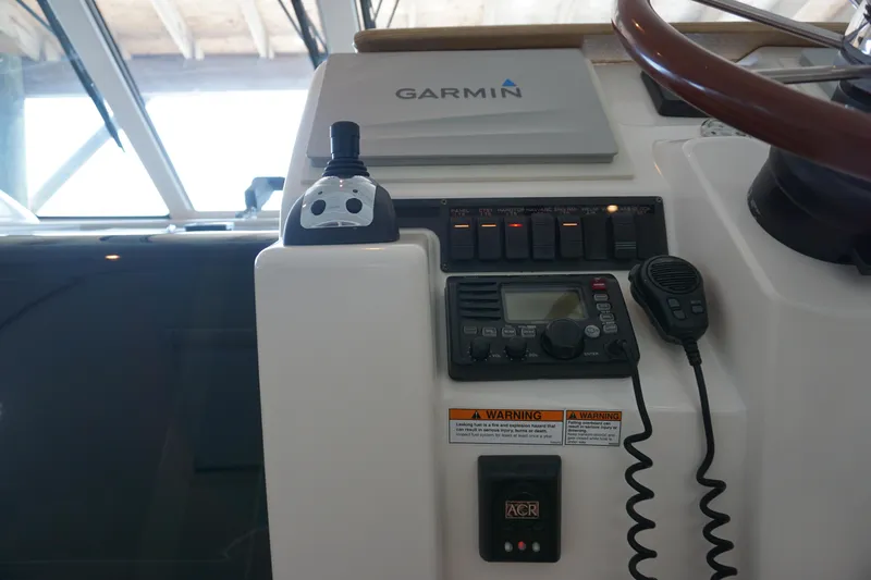 The Pearl Yacht Photos Pics Helm of 2007 Tiara Yachts 3900 with Garmin navigation and communication equipment.