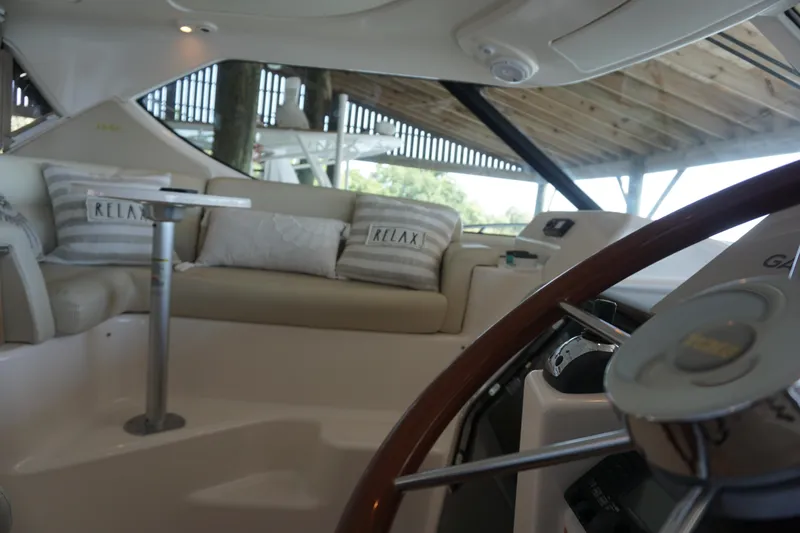 The Pearl Yacht Photos Pics 2007 Tiara Yachts 3900 interior with cozy seating and "Relax" pillows.