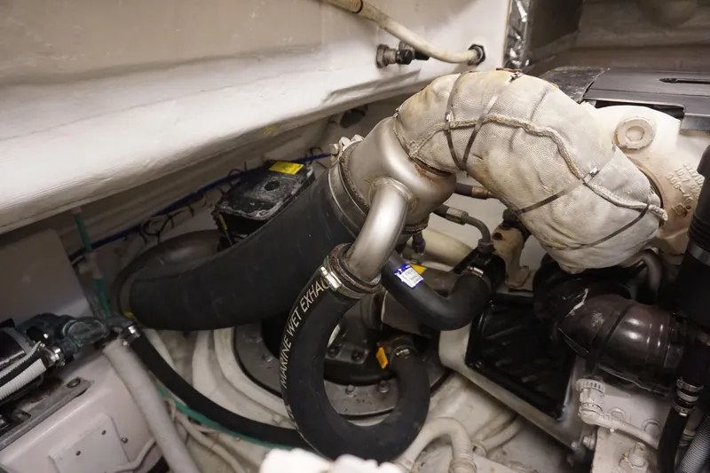 The Pearl Yacht Photos Pics Engine compartment of a 2007 Tiara Yachts 3900, showcasing exhaust and piping components.