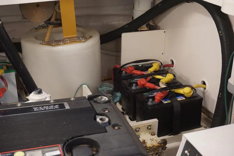 The Pearl Yacht Photos Pics Engine compartment of a 2007 Tiara Yachts 3900, featuring batteries and mechanical components.