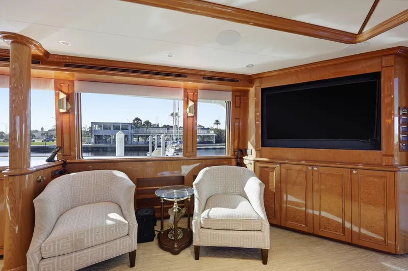 Footloose Yacht Photos Pics Luxurious interior of 2008 Cheoy Lee 95 Motor Yacht with elegant seating and large TV.