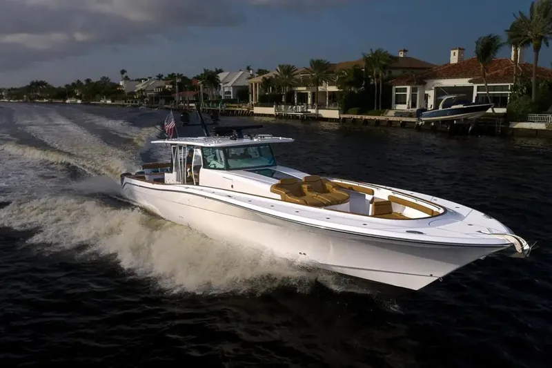 Next To Sell Yacht Photos Pics 2020 HCB Estrella luxury boat cruising on a scenic waterway near waterfront homes.