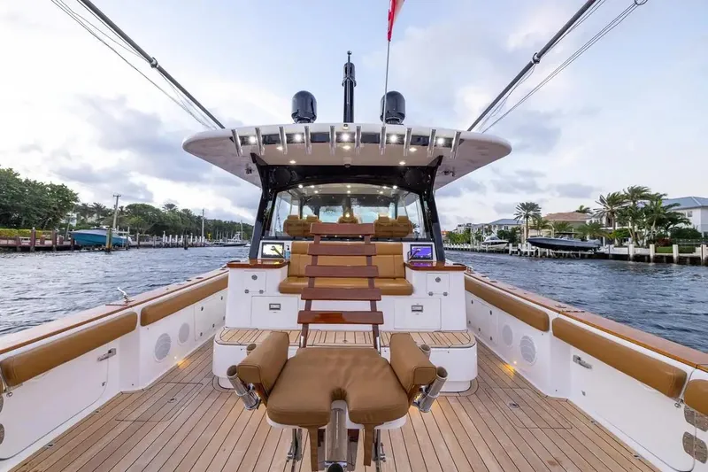 Next To Sell Yacht Photos Pics 2020 HCB Estrella luxury boat interior with seating, docked by waterfront homes.