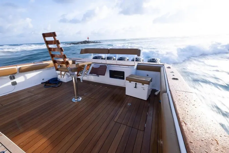 Next To Sell Yacht Photos Pics 2020 HCB Estrella boat with wooden deck cruising on open water.