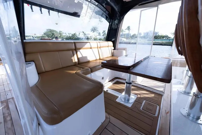 Next To Sell Yacht Photos Pics Luxurious interior of 2020 HCB Estrella boat with leather seating and wooden table.