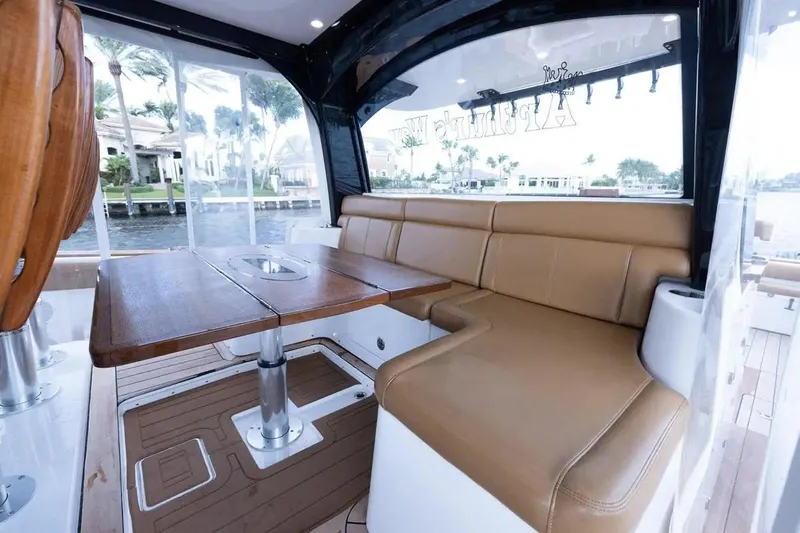Next To Sell Yacht Photos Pics Luxurious interior of 2020 HCB Estrella yacht with leather seating and wooden table.