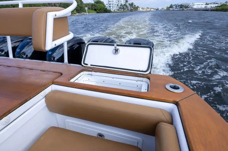 Next To Sell Yacht Photos Pics 2020 HCB Estrella boat interior with open storage, cruising on water.